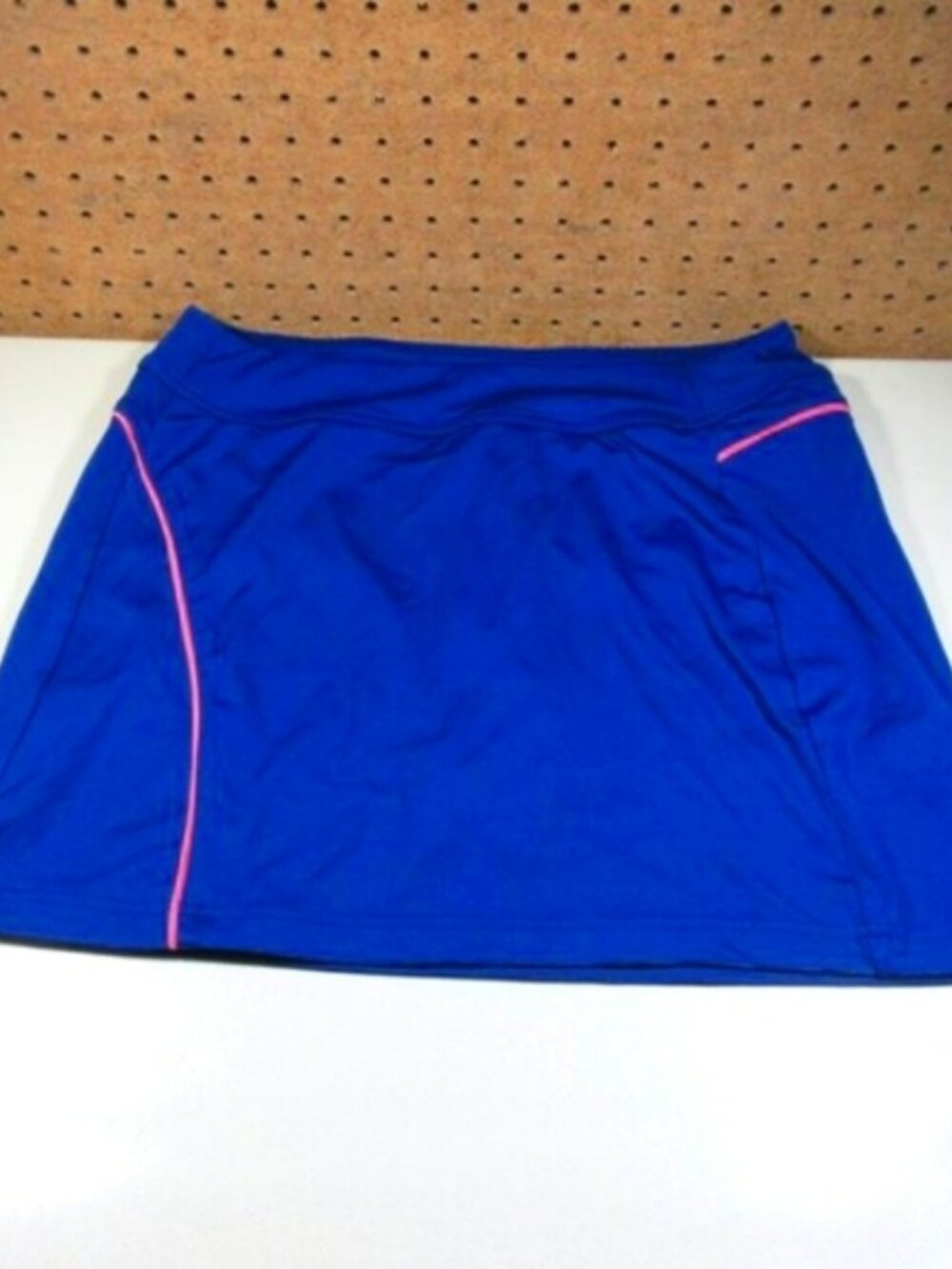 Under Armour womens blue an pink LOOSE golf skort S EUC